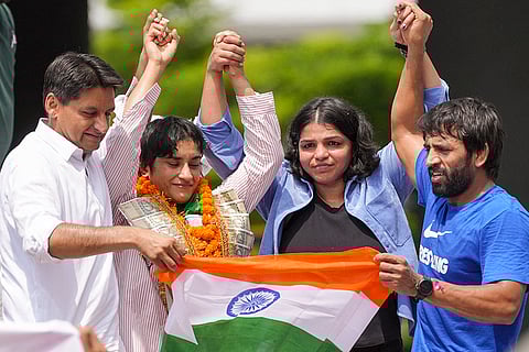 Wrestler Vinesh Phogat with Bajrang Punia, Sakshi Malik and Congress MP Deepender Singh Hooda